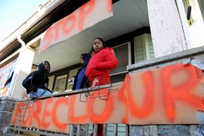 Protesters and family gathered to stop the eviction of Melonie Griffiths-Evans in the Dorchester neighborhood of Boston