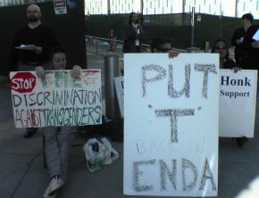 A vigil in front of the federal building against dropping transgender protections from ENDA