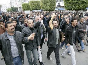 Tunisians march in Tunis for bread and an end to the reign of a dictator