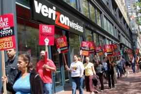 Workers picket outside a Verizon store in New York last August